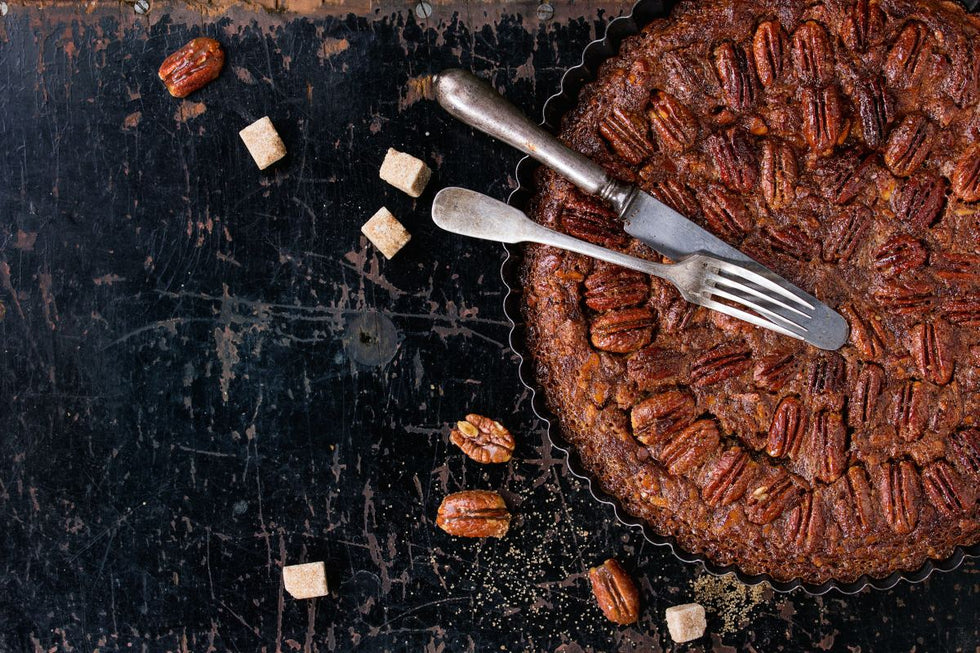 Bourbon pecan pie recipe with whole toasted pecans baked in a fluted tart pan