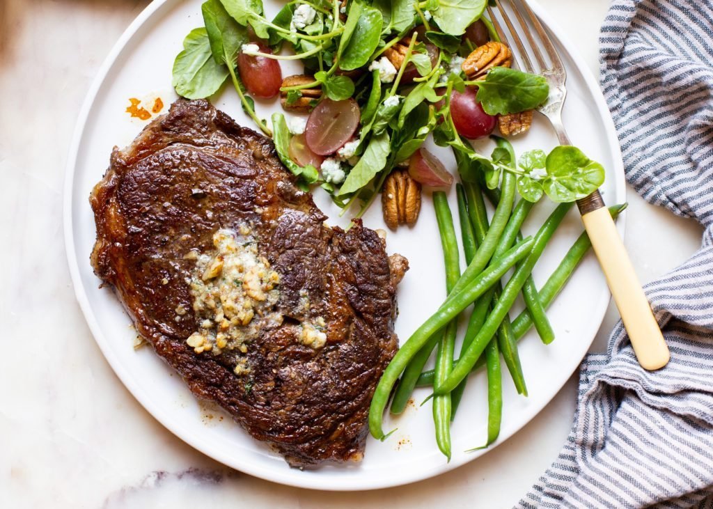 Millican Pecan - Ribeye-Steak with Pecan Blue Cheese and Herb Compound Butter