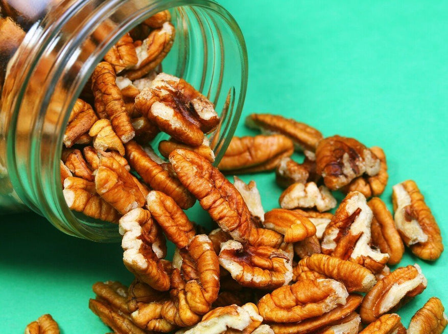pecans spilling out of a jar to show how long pecans last