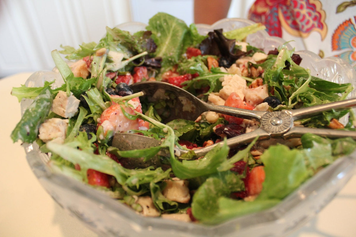 Strawberry salad with pecans and chicken in a bowl